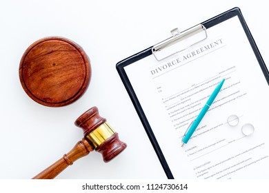 Divorce Court Case. Divorce Agreement Near Wedding Rings And Judge Gavel On White Background Top View