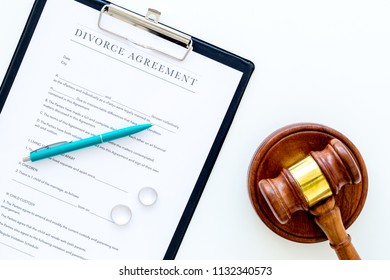 Divorce Court Case. Divorce Agreement Near Wedding Rings And Judge Gavel On White Background Top View