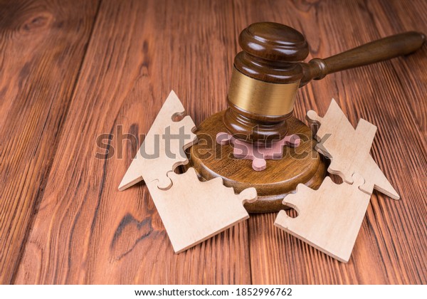 Divorce property division concept.\
hammer judge, the house is divided by the puzzle. Court\
law