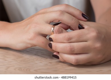 Divorce, Separation: Woman Removing Wedding Or Engagement Ring