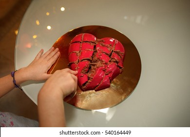 Divorce, Woman Cuts Cake In Shape Of Heart, Broken Love Concept 