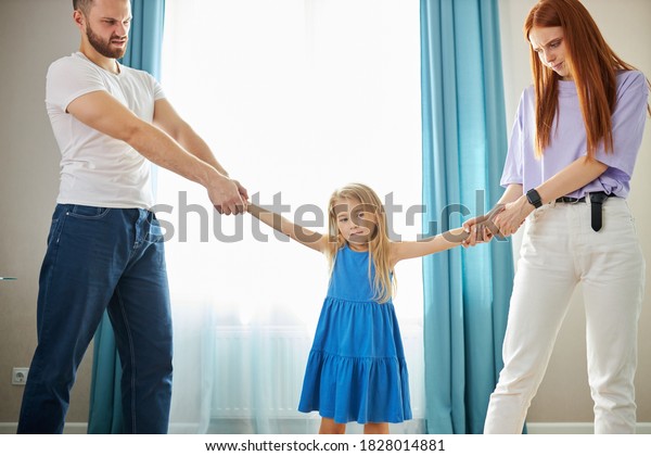 divorced\
caucasian parents arguing about child custody, divide property and\
child. parental fmaily quarrels\
concept