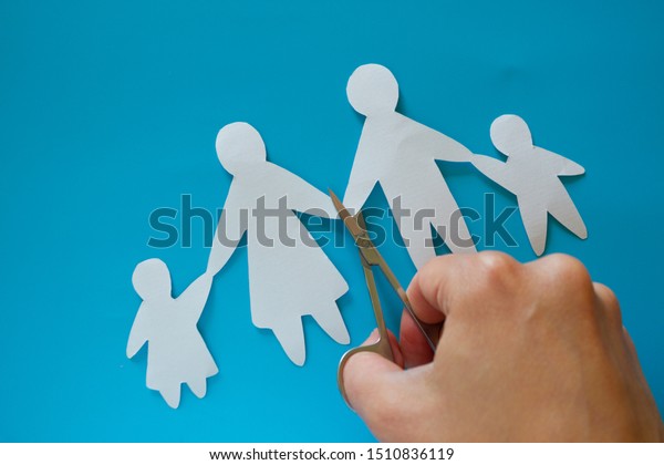 Divorced paper family couple with childrent.\
Blue background