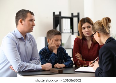 Divorced parents with their son visiting lawyer. Concept of child support