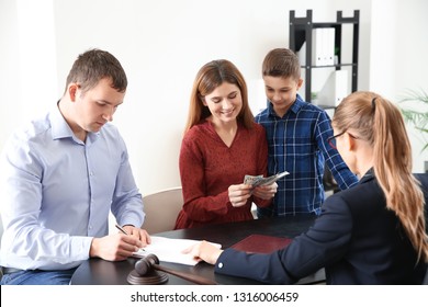 Divorced parents with their son visiting lawyer. Concept of child support