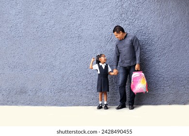 Divorced single dad picks up his brunette Latina daughter from school, carries her backpack and talks about his day - Powered by Shutterstock