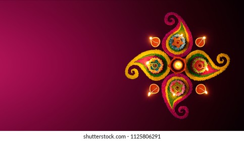 Diwali celebration - Diya oil lamps lit on colorful rangoli - Shutterstock ID 1125806291