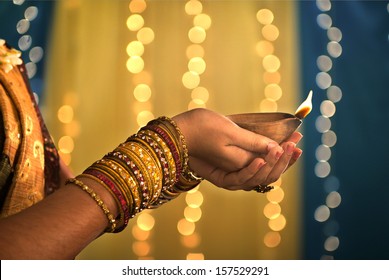 Diwali Festival Of Lights , Hands Holding Indian Oil Lamp