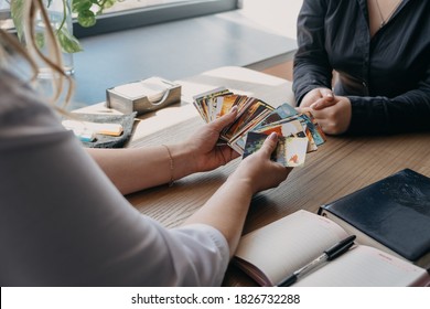 Dixit Card Game As Support For Metaphorical Representations, Systemic Therapy. Psychologist Woman Having Session With Patient With Metaphorical Associative Cards. Kropivnitskiy, Ukraine, July 20, 2020