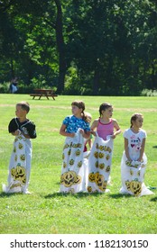 Dixon, IL - July 16, 2010: Children Compete In A Sack Race At A Family Campout