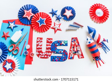 Diy 4th of July decor USA letters color American flag. Patriotic holiday. Process kid children craft. Rocket with fireworks