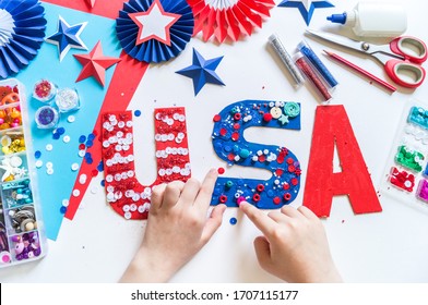 Diy 4th of July decor USA letters color American flag. Patriotic holiday. Process kid children craft. Rocket with fireworks