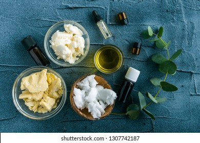 diy body butter with ingredients on concrete background