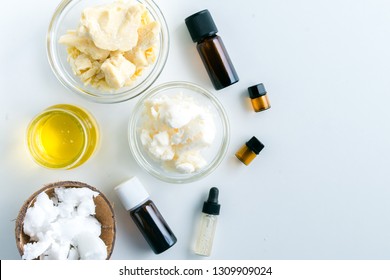 diy body butter with ingredients on concrete background