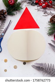 DIY Christmas Card Step By Step. From Colored Paper And Cotton Wool On A White Concrete Table. Image No. 1