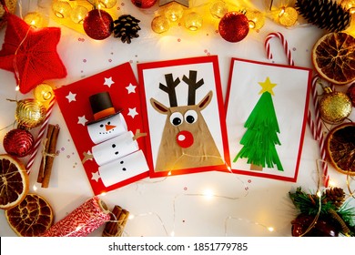 DIY Christmas Cards Kids. Three Cards With A Christmas Tree, A Deer, A Snowman From Colored Paper.