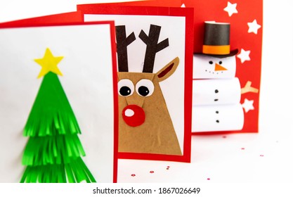 DIY Christmas Cards Kids. Three Cards With A Christmas Tree, A Deer, A Snowman From Colored Paper.