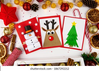 DIY Christmas Cards Kids. Three Cards With A Christmas Tree, A Deer, A Snowman From Colored Paper.