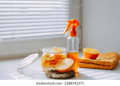DIY cleaning spray, natural toxic free home cleaner, orange peel infused vinegar. Zero waste homemade citrus cleaner for all purpose cleaning. Eco friendly sustainable living concept. Side view
