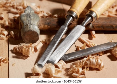 DIY concept. Woodworking and crafts tools. Carpentry hand tools on a workbench. Planers, chisels, measuring tools.  Wooden parts, planks and stocks. Wooden background.