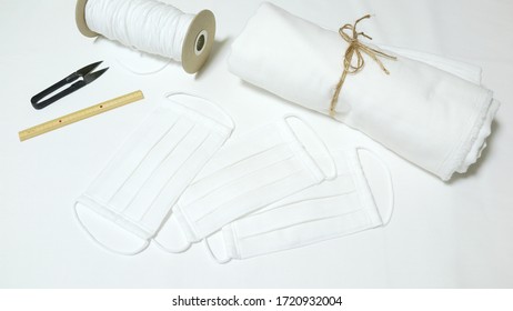 DIY Cotton Pleated Mask And Handicraft Tools On The Desk. Handmade Concept.