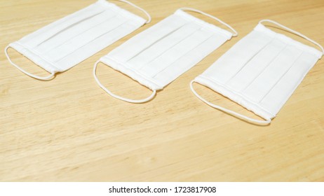 DIY Cotton Pleated Mask And Handicraft Tools On The Wooden Table. Handmade Concept.