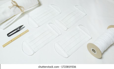 DIY Cotton Pleated Mask And Handicraft Tools On The Wooden Table. Handmade Concept.