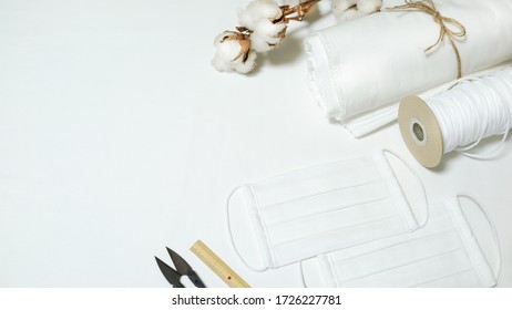 DIY Cotton Pleated Mask And Handicraft Tools On The Wooden Table. Handmade Concept.