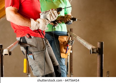 DIY Couple In Home Improvement With Hand Drill Standing On A Scaffold