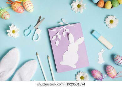 Diy Easter Card From Paper. Greeting Cards With Bunny On Blue Background. Gift Idea, Decor Spring, Easter. Top View. Process Kid Children Craft.