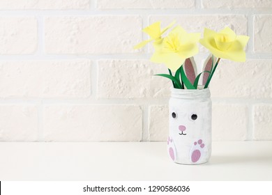 DIY Easter Vase Bunny From Glass Jar, Felt, Googly Eyes On A Green Background. Gift Ideas, Decor For Spring, Easter. Handmade. Step By Step. The Process Of Crafts. Top View. Childrens Easter Crafts.