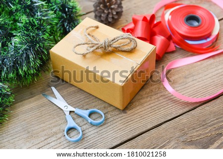 Similar – Foto Bild Weiße Geschenkbox mit Aufkleber auf Holztisch.