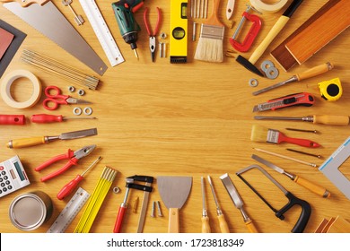 DIY And Home Improvement Banner With Work And Construction Tools On A Wooden Workbench Top View, Copy Space At Center