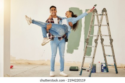 Diy, Home Improvement And Wall Painting With Happy Couple Renovating House And Having Fun Together. Playful Husband And Wife Being Silly And Goofy, Enjoying Their Relationship And Project Together