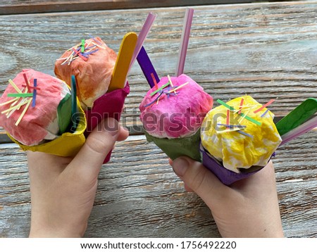 DIY ice cream cone in children's hands, for playing.