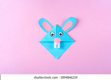 DIY and kid's creativity, origami. Step by step instruction: how to make bookmark easter bunny. Step 9 Finished bookmark for book, funny rabbit. Easter craft
