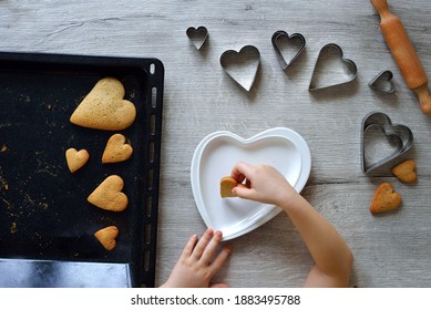 DIY making gingerbread by kid for Valentine's Day for parents. Baking training for children from 4 to 14 years old. early child development of fine motor skills. step by step. step 6. view from above