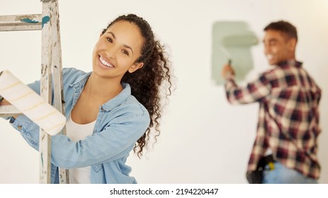 DIY, Painting And Happy Interior Design Couple With Smile Bonding While Working On Family Home, Building Or Room. Woman Portrait With Man In Background Remodeling House Wall As Real Estate