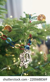 DIY Paper Chain And Wooden Pendant Hanging On Christmas Tree