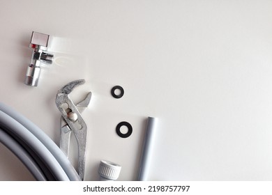 Diy Plumbing Background With Tools And Materials On White Table. Top View. Horizontal Composition.