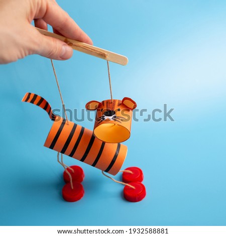 DIY toilet paper roll craft, homemade tiger toy for kids, marionette from recycled materials
