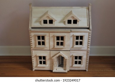 A DIY Wooden Doll House In A Child's Room To Play Pretend. 