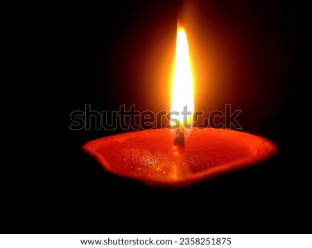 A Diya's flame is continually burning upward with the goal of learning things that will lead us to greater ideals, disseminates goodness and optimism.