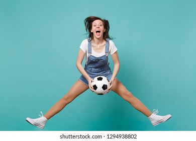 Dizzy woman football fan cheer up support favorite team holding soccer ball jumping isolated on blue turquoise background. People emotions, sport family leisure lifestyle concept. Mock up copy space - Shutterstock ID 1294938802