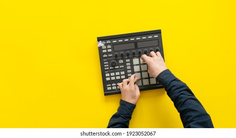 dj audio producer fingers play the drum music on pads of drum machine