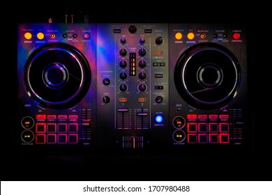 
Dj console and audio mixer, top view, with color lights.