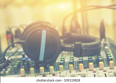 Dj Equipment In A Studio Working With Sound And Light Mixer Console ,headphones Resting On The Top,boutique Recording Tools  Desk,selective Focus,vintage Color