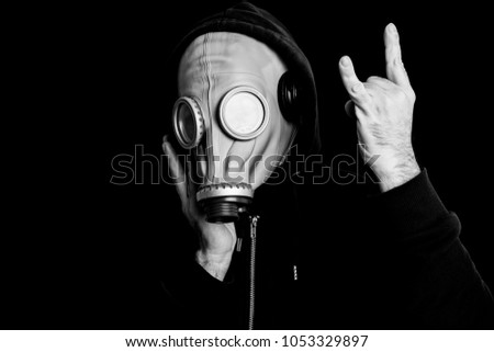 DJ in gasmask and black hood