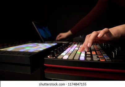 Dj hand remixing music on midi controller