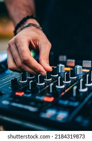 DJ Hands Creating And Regulating Music On Dj Console Mixer In Concert Outdoor